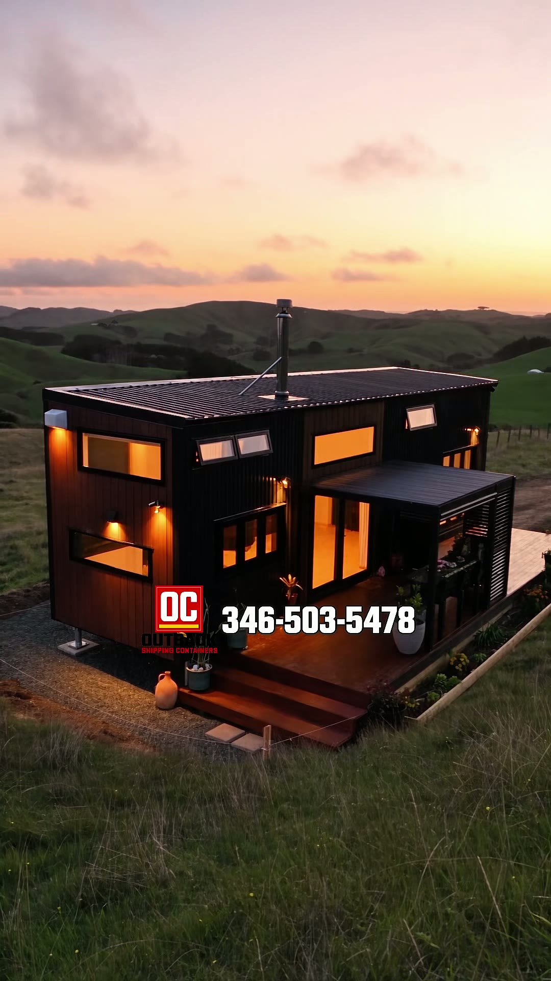 Finished Luxury 40ft Prefab Container House at dusk, fully set up with illuminated windows, deck and pergola